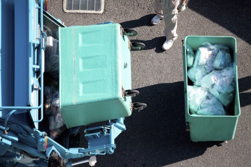 Professional removers handling furniture disposal